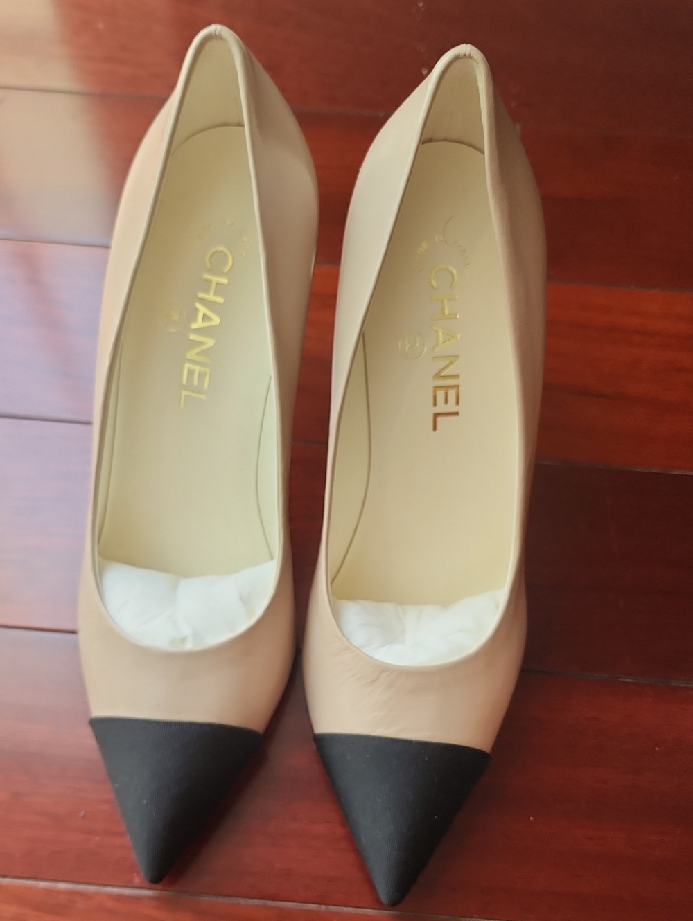 CHANEL Beige and Black Cap-Toe Pointed Pumps